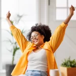 Person feeling happy about their financial coaching support