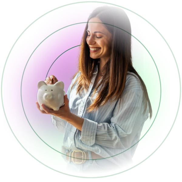 Women putting money in piggy bank after taking EAP financial coaching