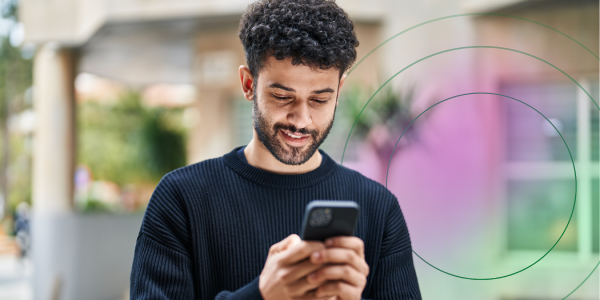 Man on his phone, enjoying the features of the Converge App (2)
