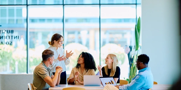Team identifying employee needs for workplace wellbeing strategy